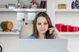 A woman entrepreneur managing her small business inventory with focus.