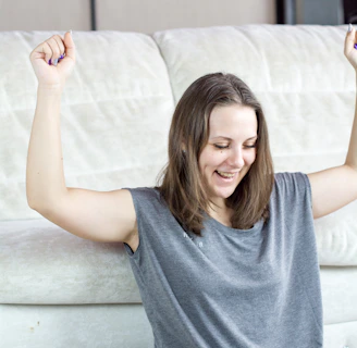 Joyful winner celebrating after hitting a big online slot jackpot on laptop