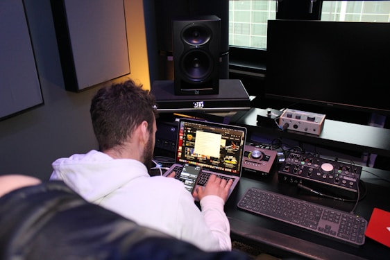 A technician assisting a client with computer setup in an office environment.