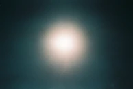 An expanded view of a successful campaign’s creative visuals glowing against a dark background.