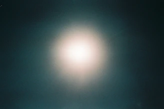 An expanded view of a successful campaign’s creative visuals glowing against a dark background.