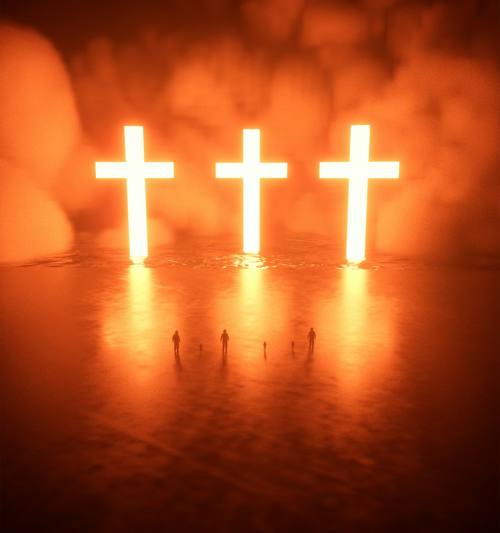 a group of people standing in front of a cross