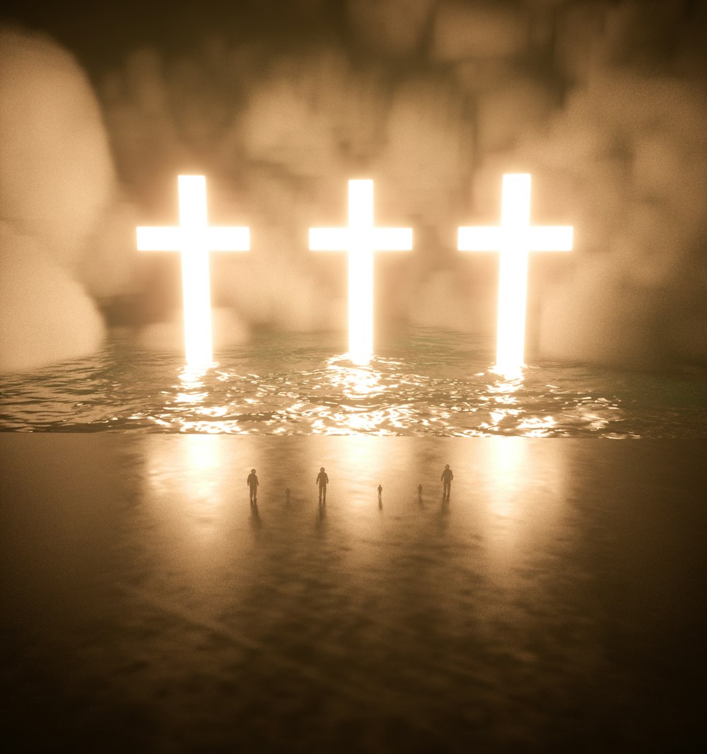 a group of people standing next to a cross in the water