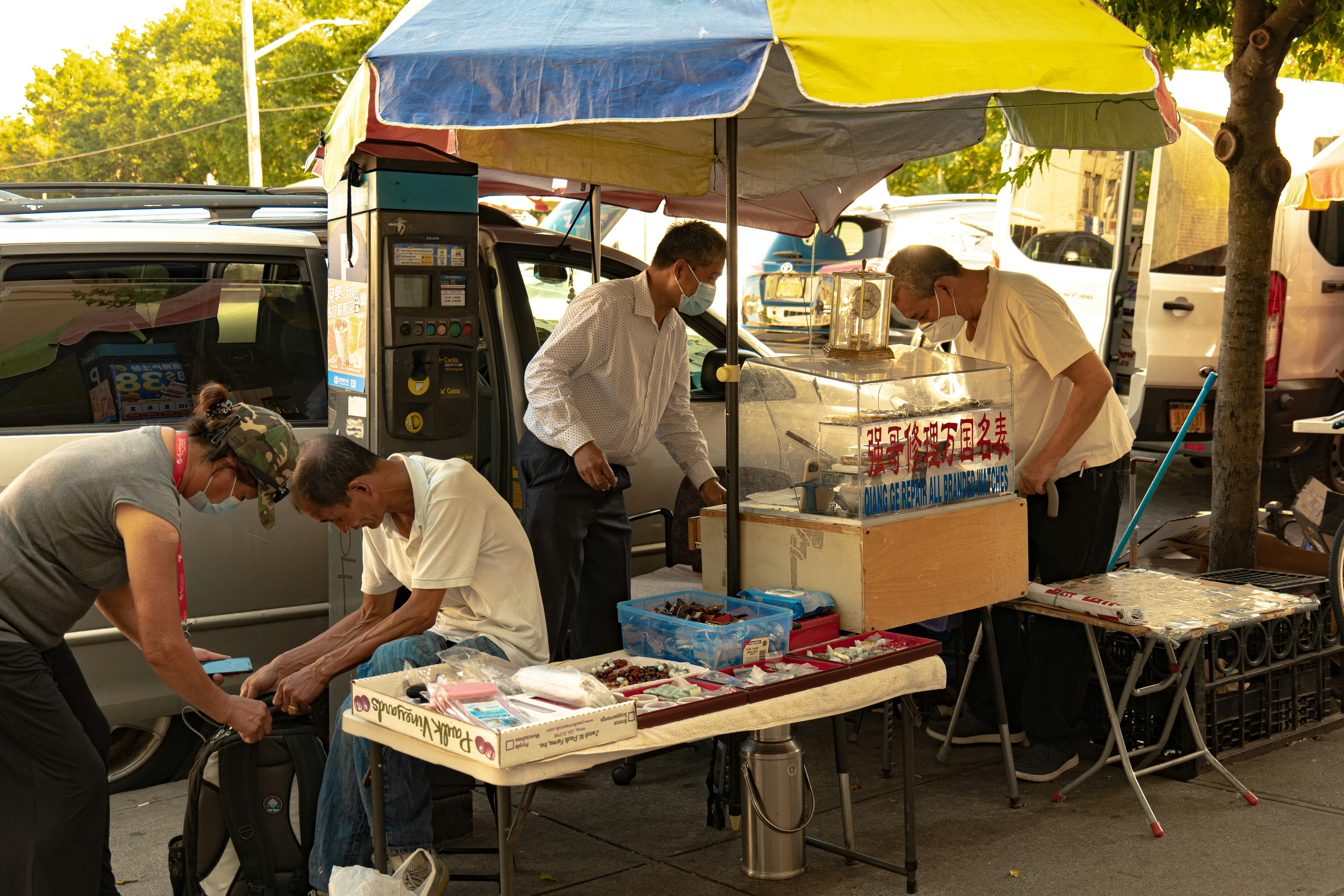 a group of people standing around a table