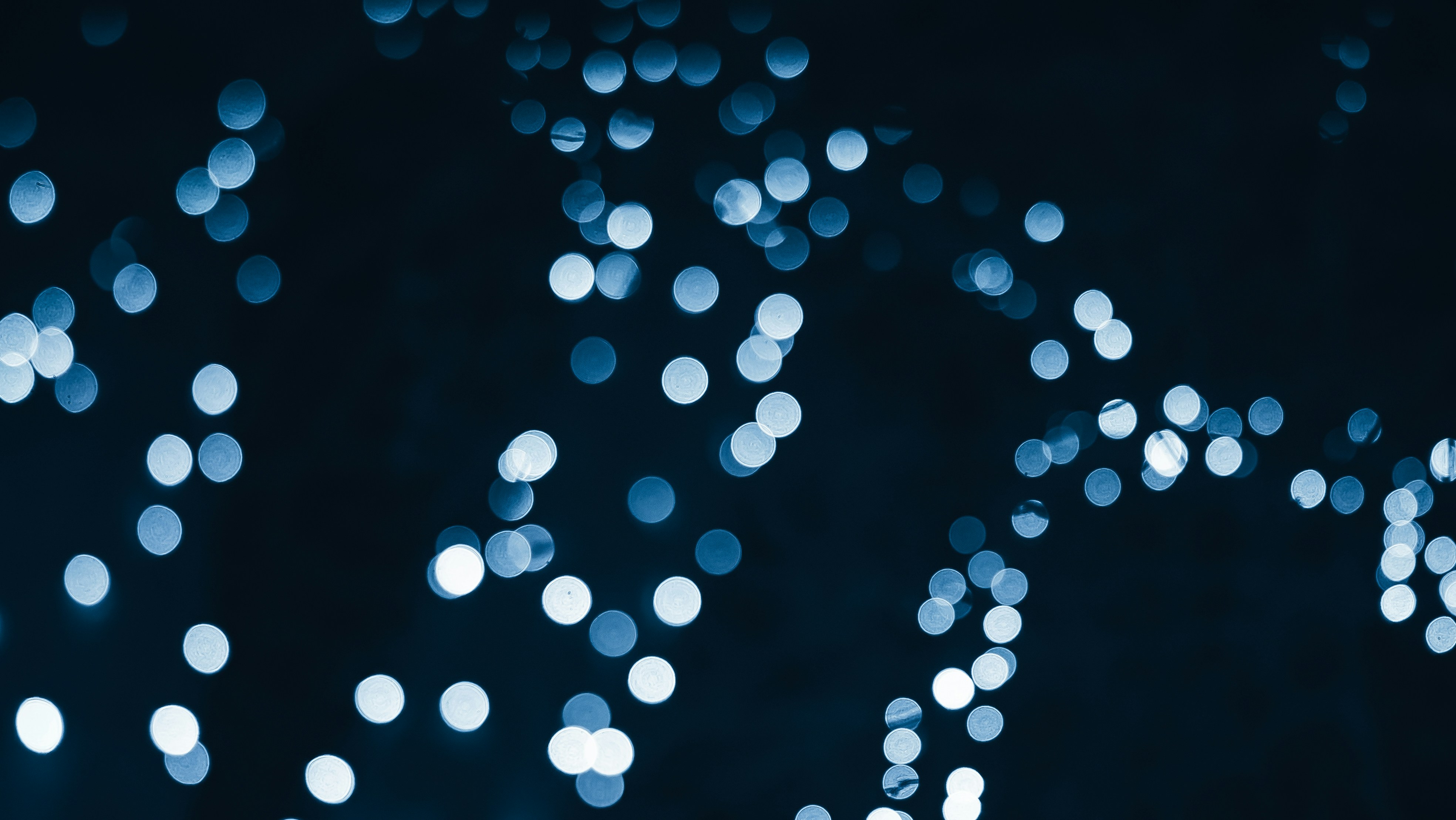 a blurry photo of blue lights in the dark