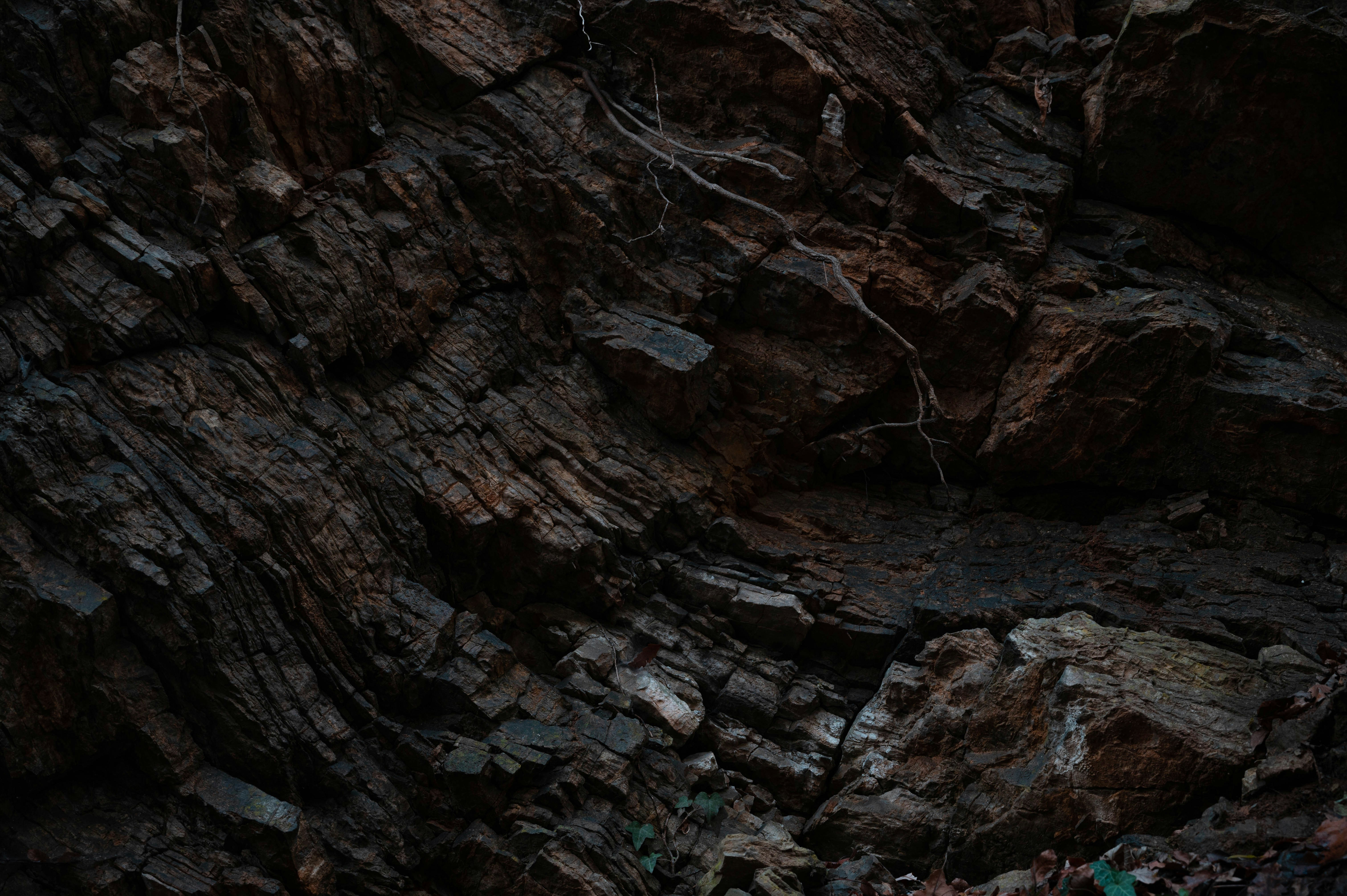 a group of people standing on top of a rocky hillside