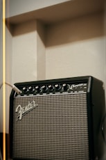 a fender guitar amplifier sitting on a shelf