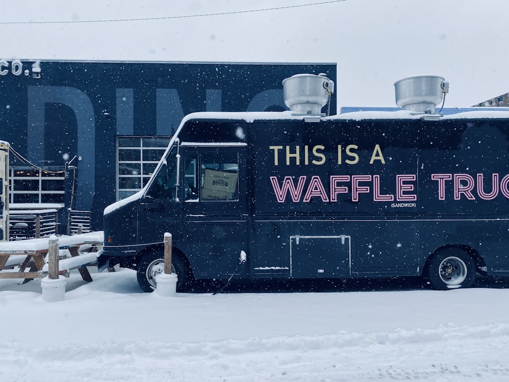 this is a waffle truck parked in the snow