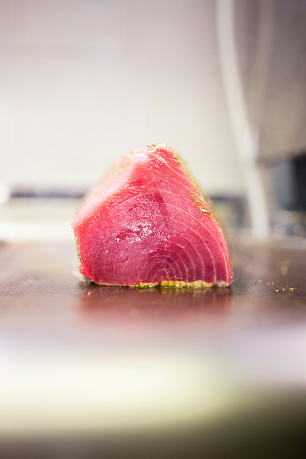 a piece of meat sitting on top of a cutting board