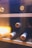Image of a stylish wine cabinet filled with bottles, placed in a warmly lit living room.