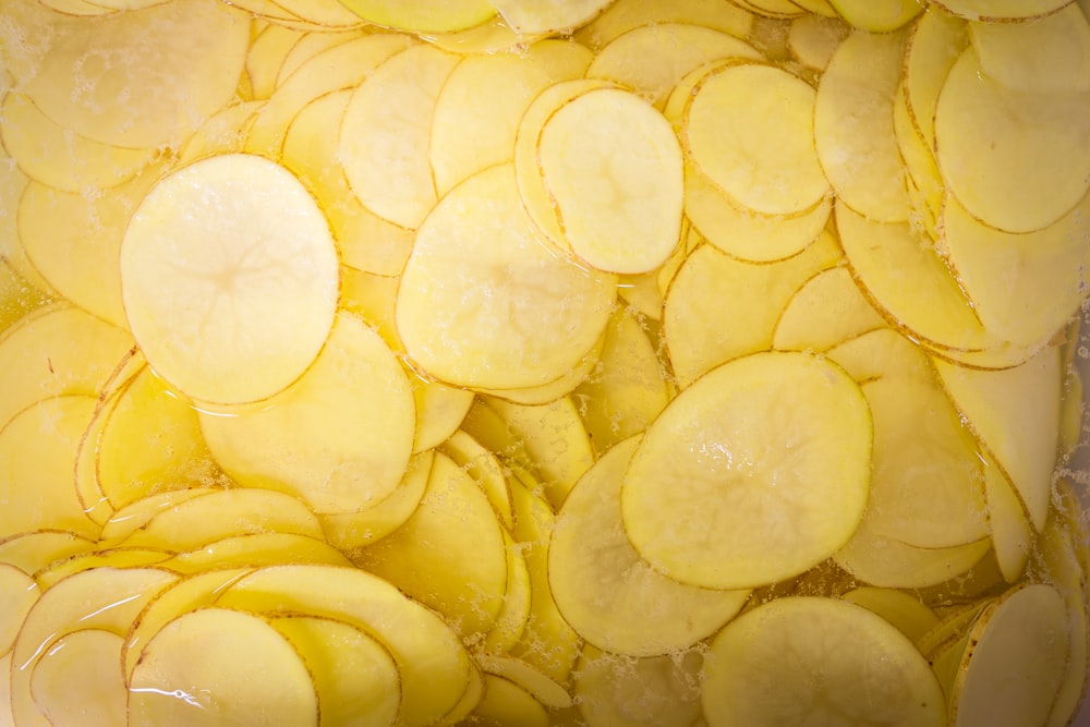 a close up of sliced potatoes in a pan