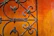 Close-up of a handcrafted iron gate with intricate details and a smooth matte finish.