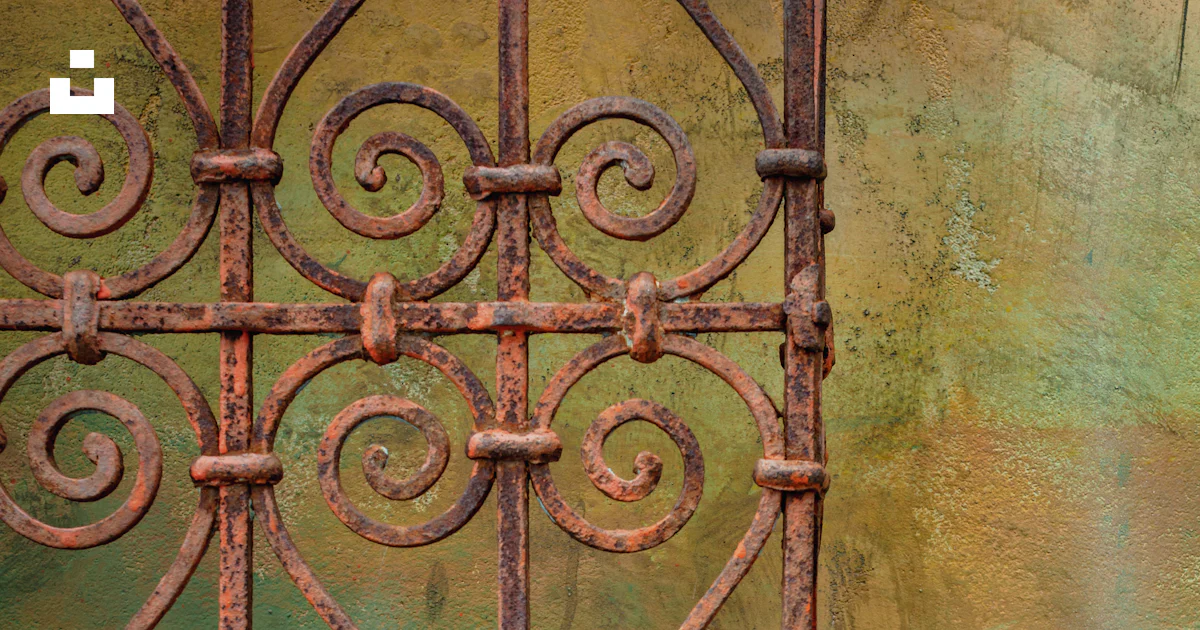 Rust Metal Window A rusted iron window on the side of a building photo – Free Corrosion ...