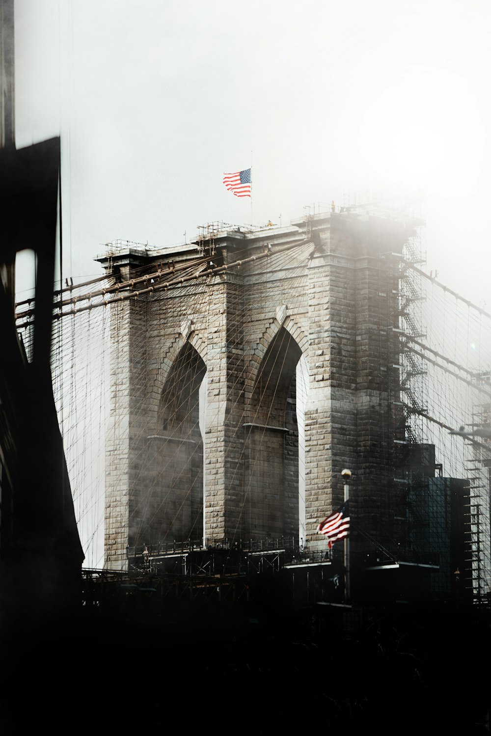 a view of a large bridge with a flag on top of it