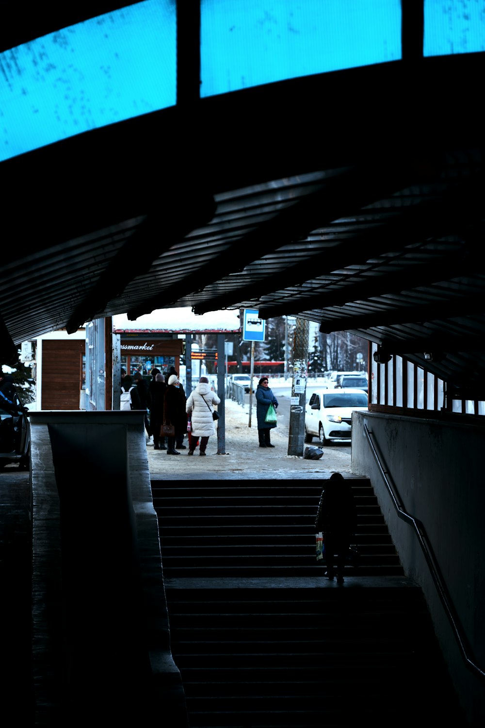 a group of people walking up and down some stairs