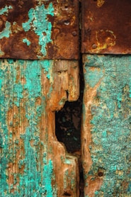 a close up of a rusted metal door