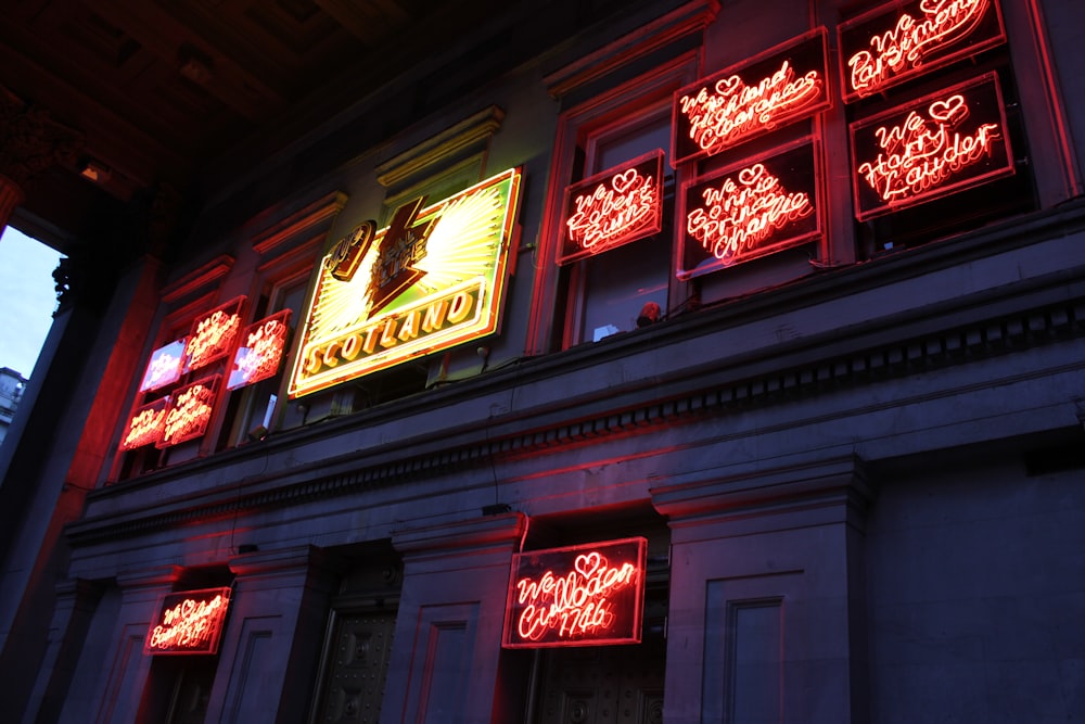 a building that has some neon signs on it