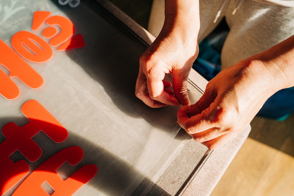 a close up of a person's hands on a table