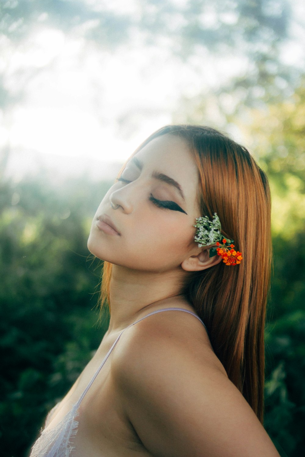 a woman with a flower in her hair