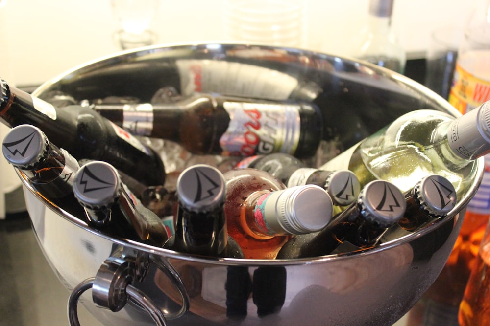 a metal bucket filled with lots of bottles