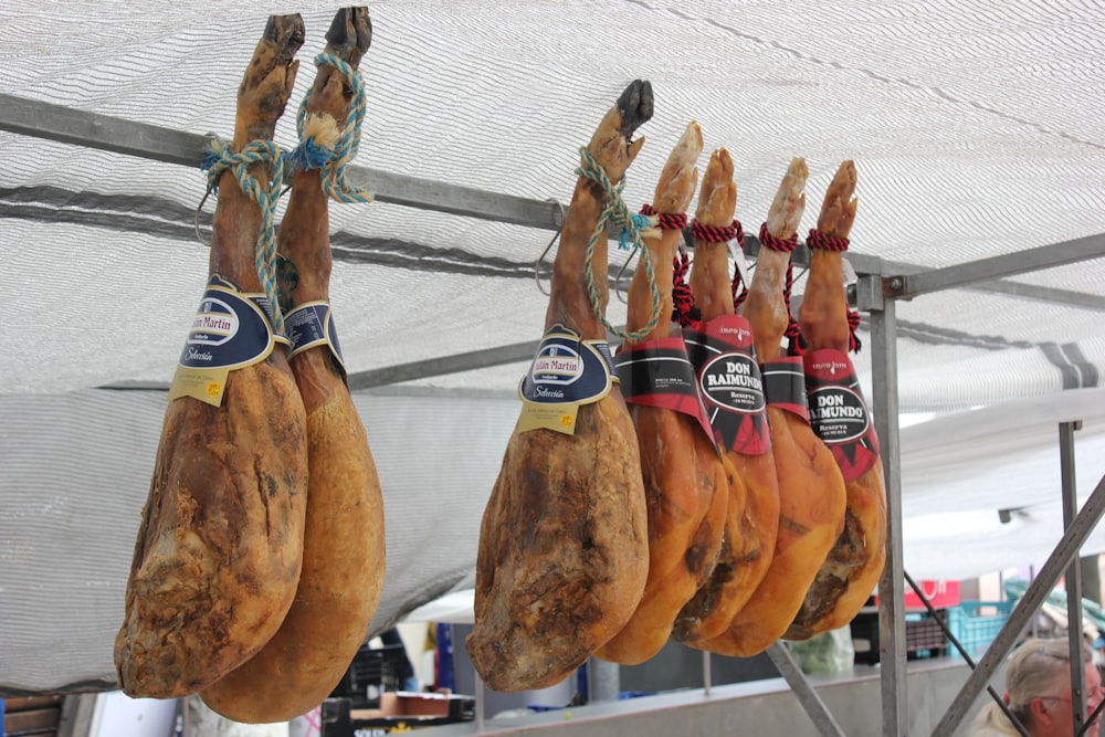 a bunch of chicken hanging from a line