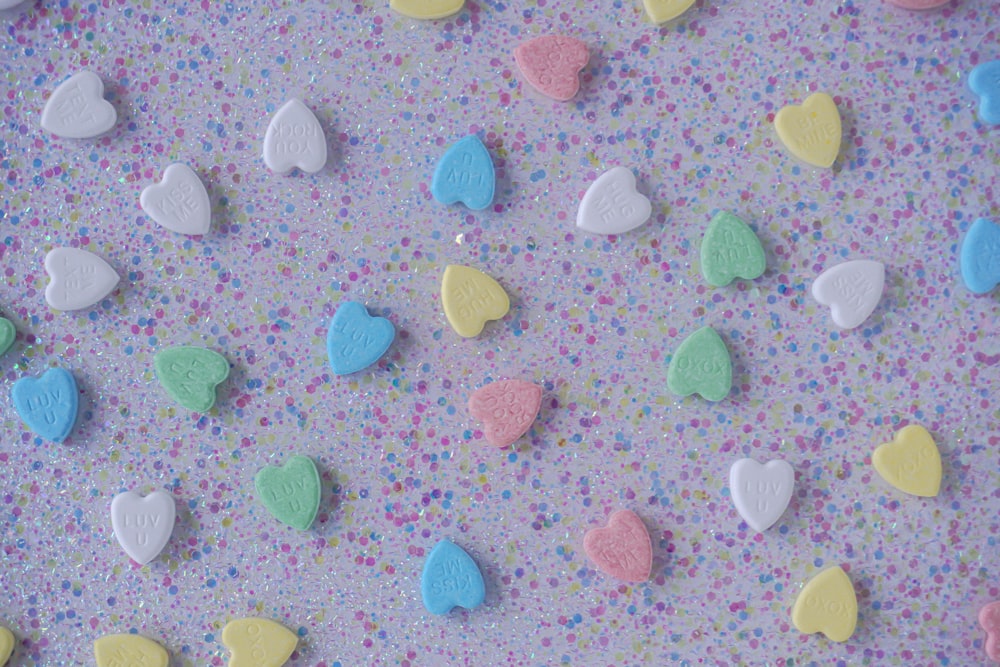 a table topped with lots of candy hearts