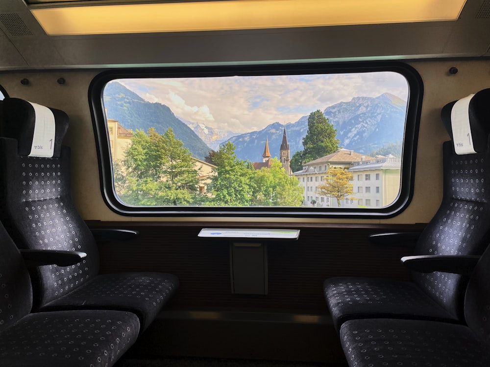 a train car with a view of mountains