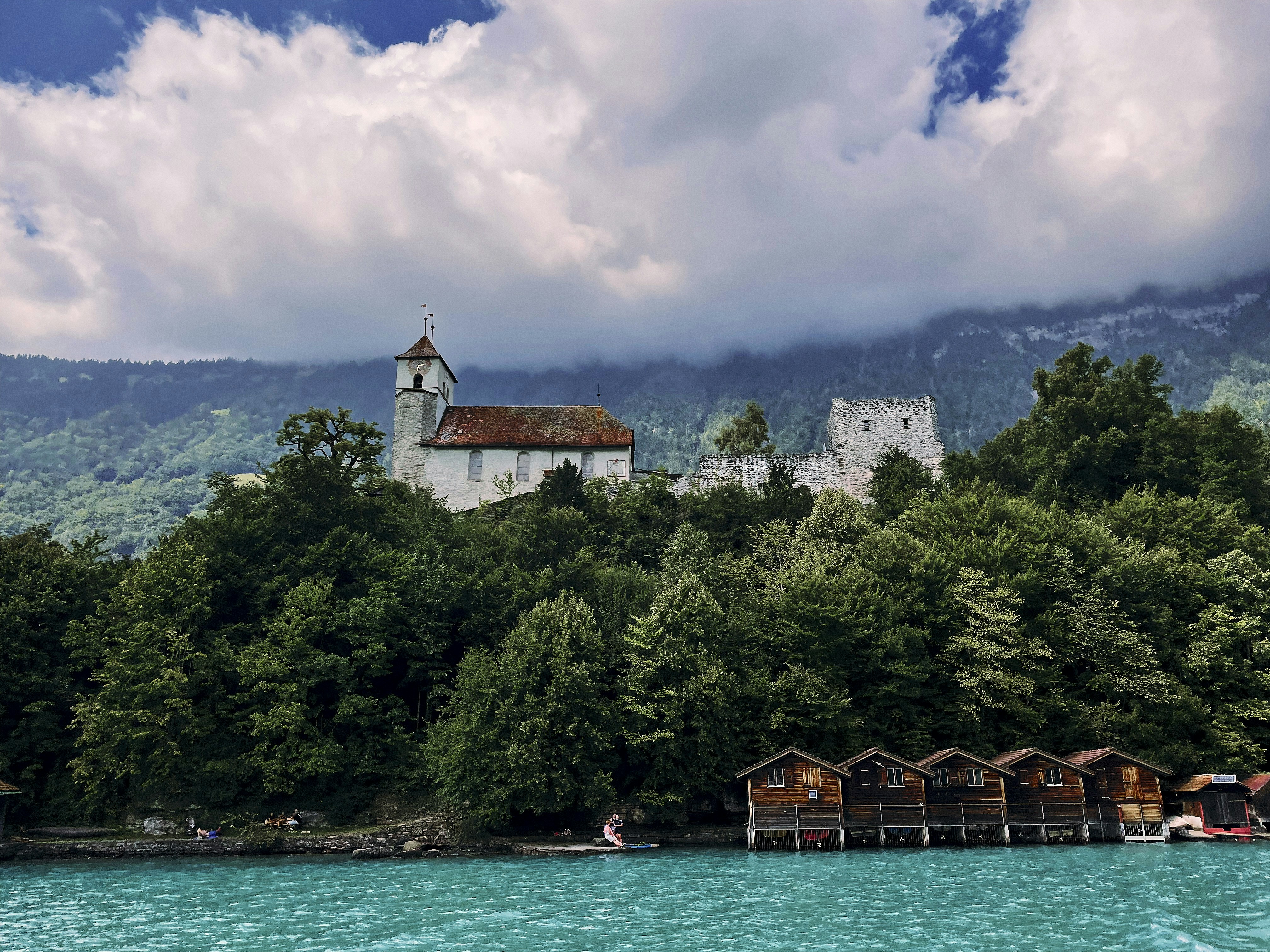 a church on a hill above a body of water