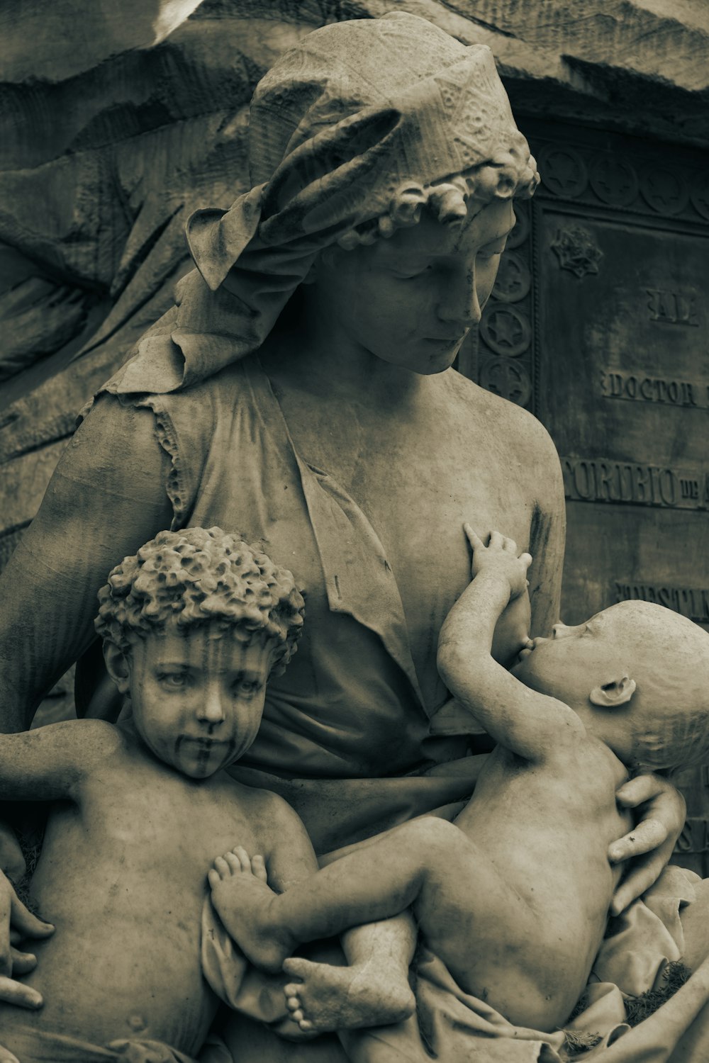 a statue of a woman holding a child