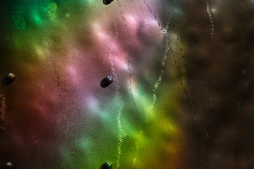 Close-up of colorful, glossy slime textures in vibrant shades, showcasing the playful essence of The Slime Pugs LLC.