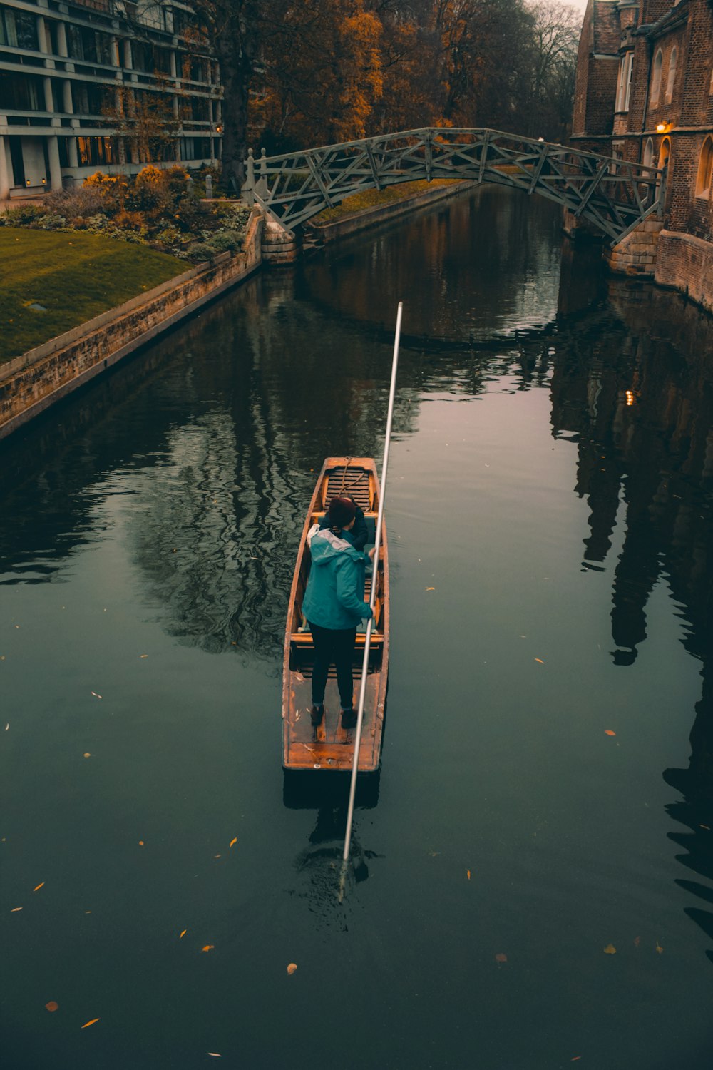 a person in a small boat on a body of water