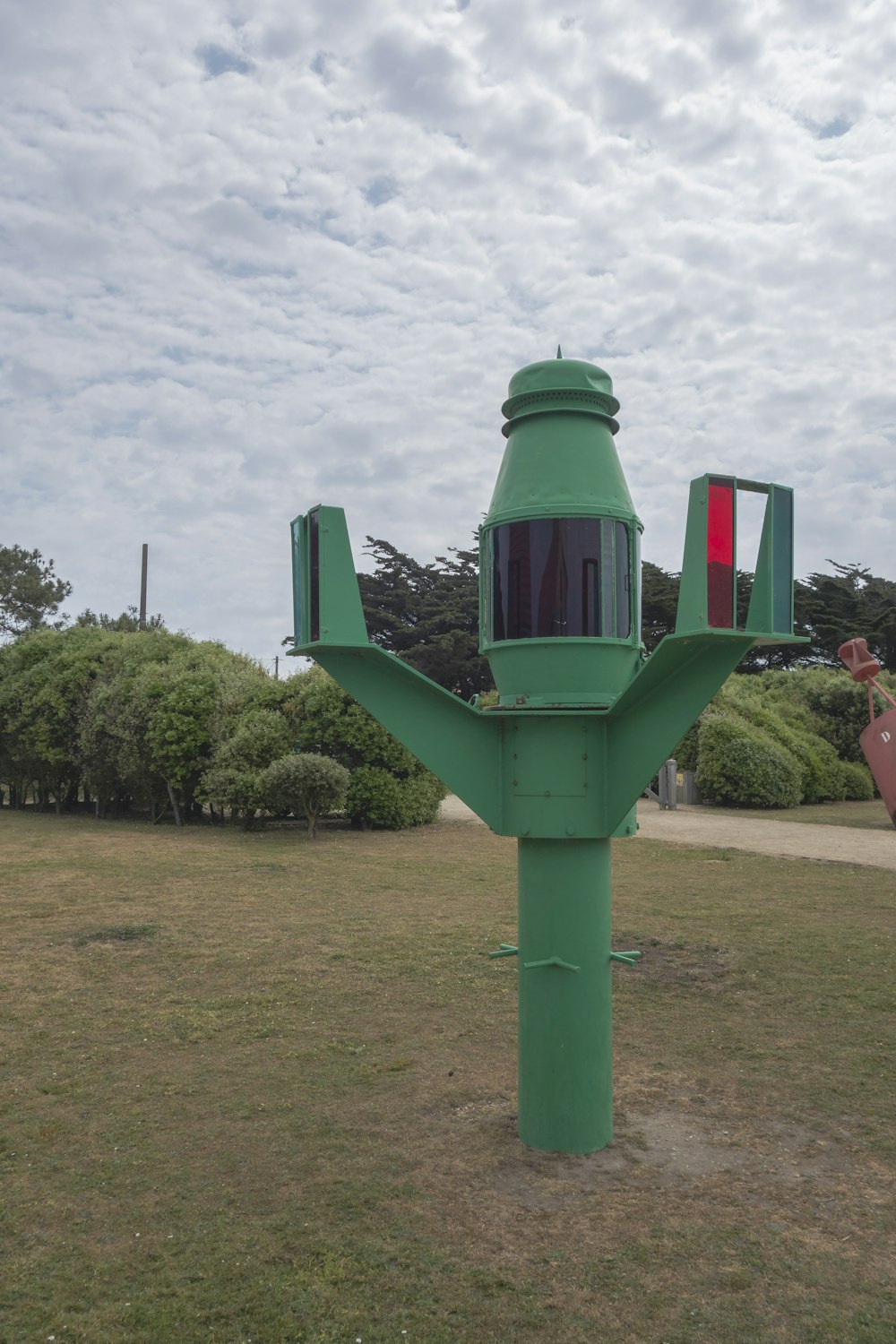 a large green object in the middle of a field