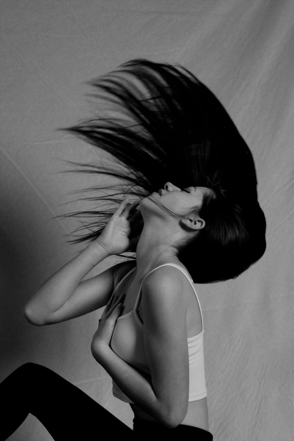 a woman with her hair blowing in the wind