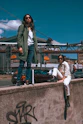 a couple of people that are sitting on a wall