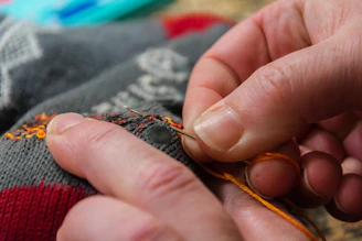 a close up of a person holding a piece of cloth