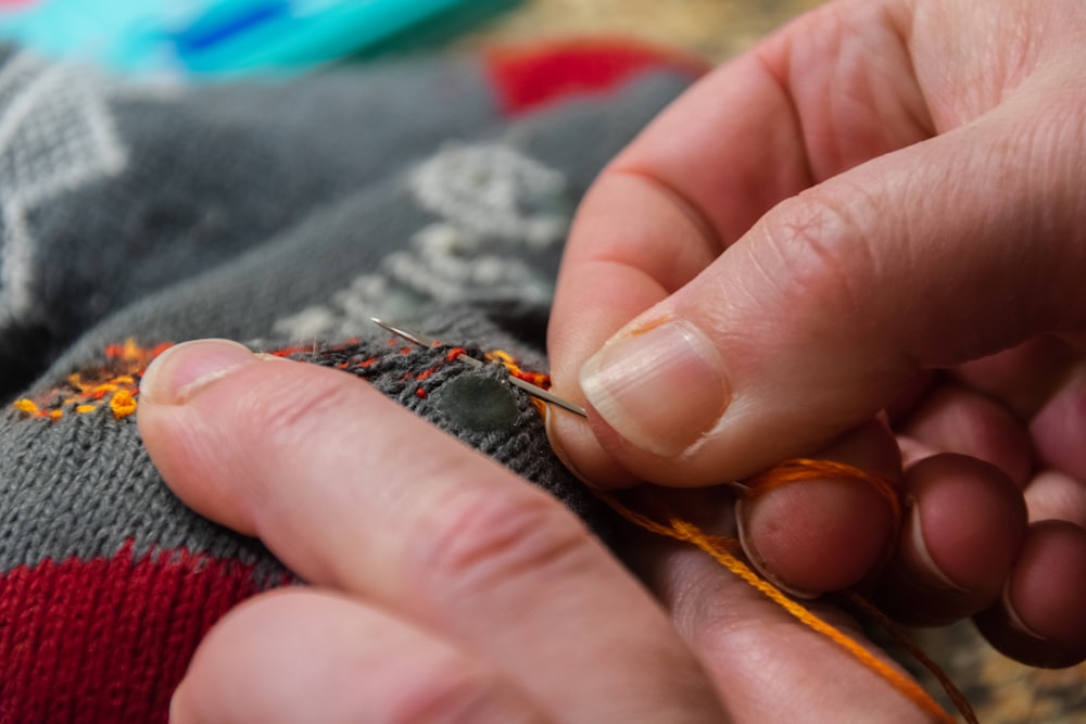 a close up of a person holding a piece of cloth