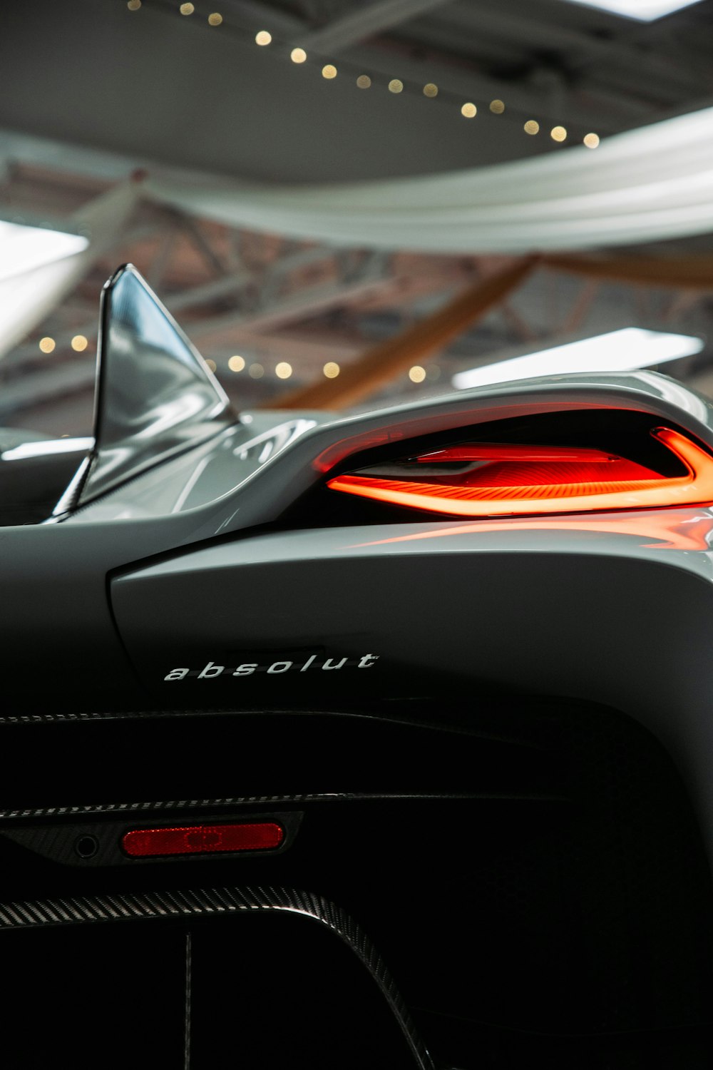 a close up of the tail lights of a sports car