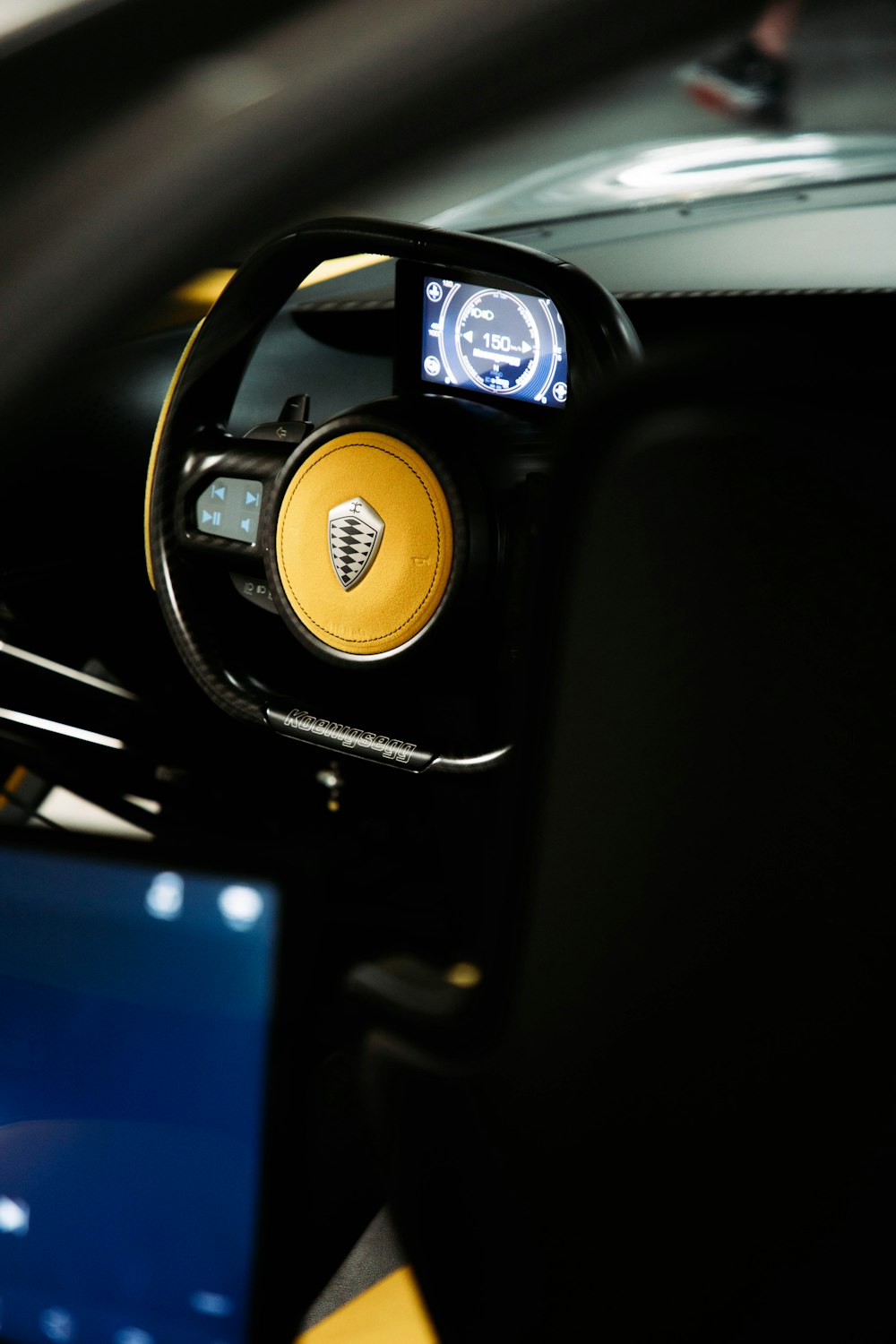 a close up of a car dashboard with a monitor