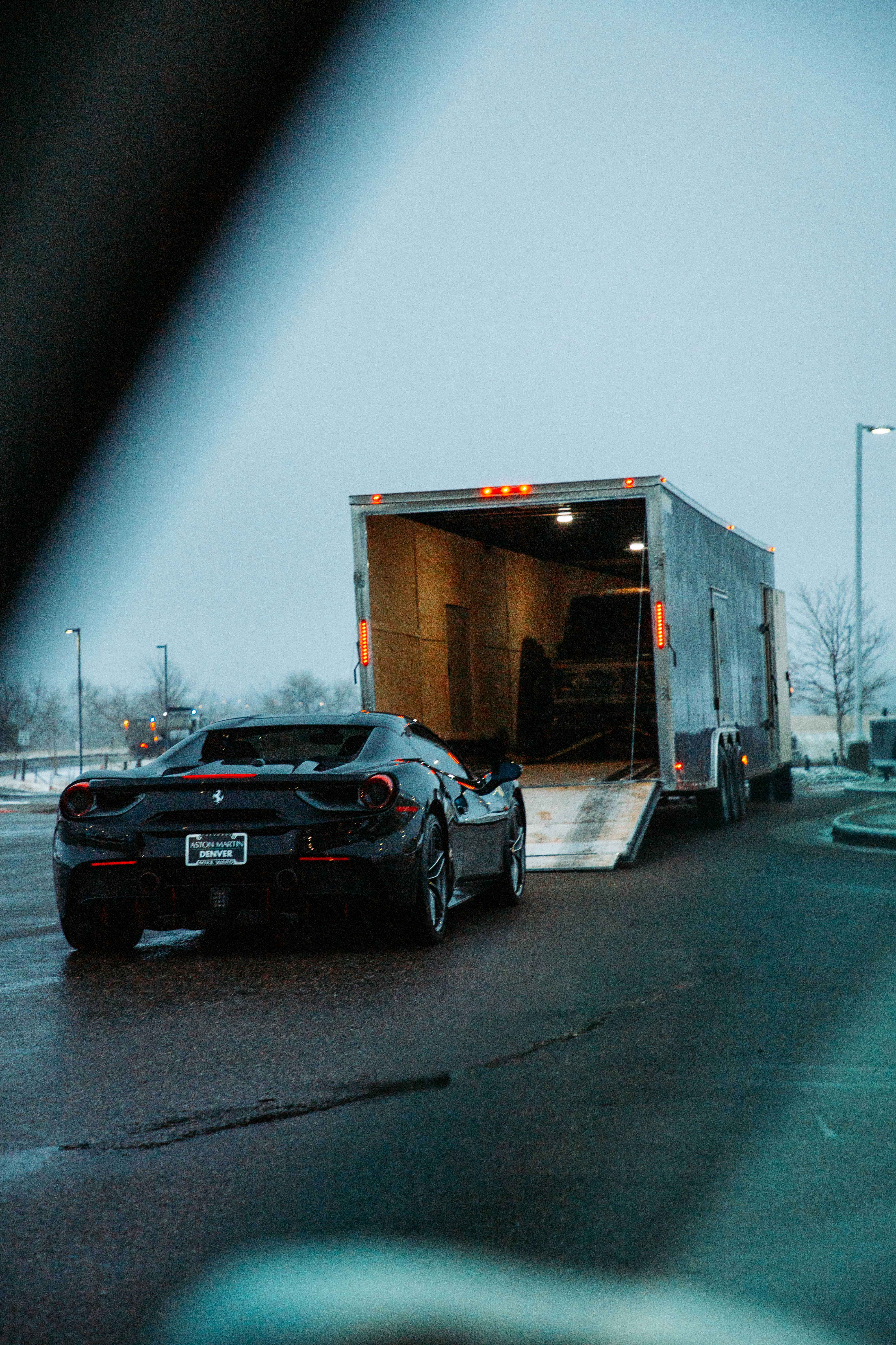 A truck with a car in the back of it photo – Free Denver Image on Unsplash