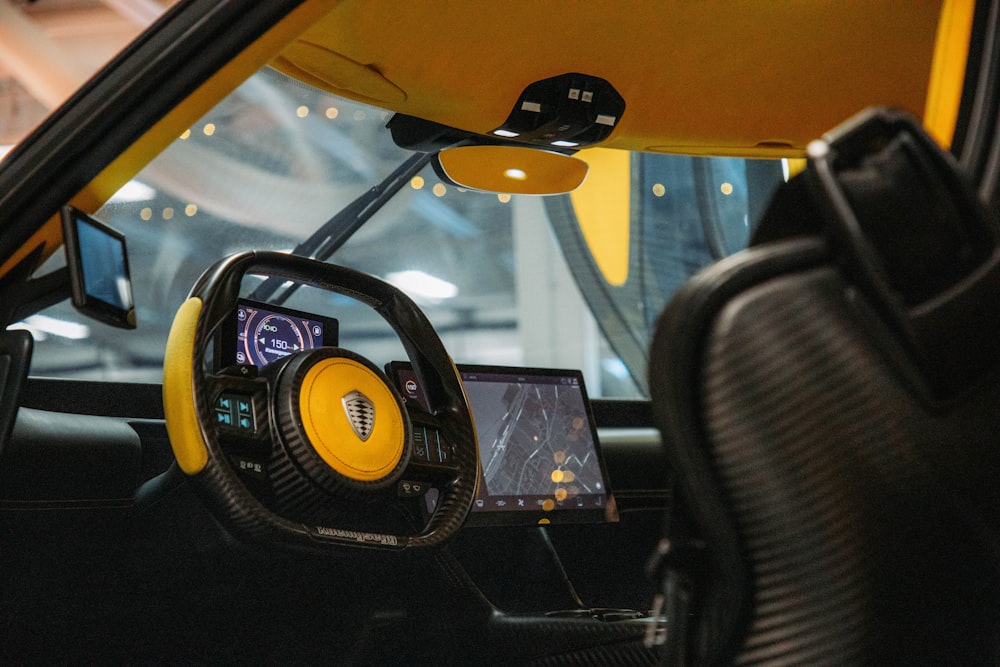 the interior of a car with a yellow dash board