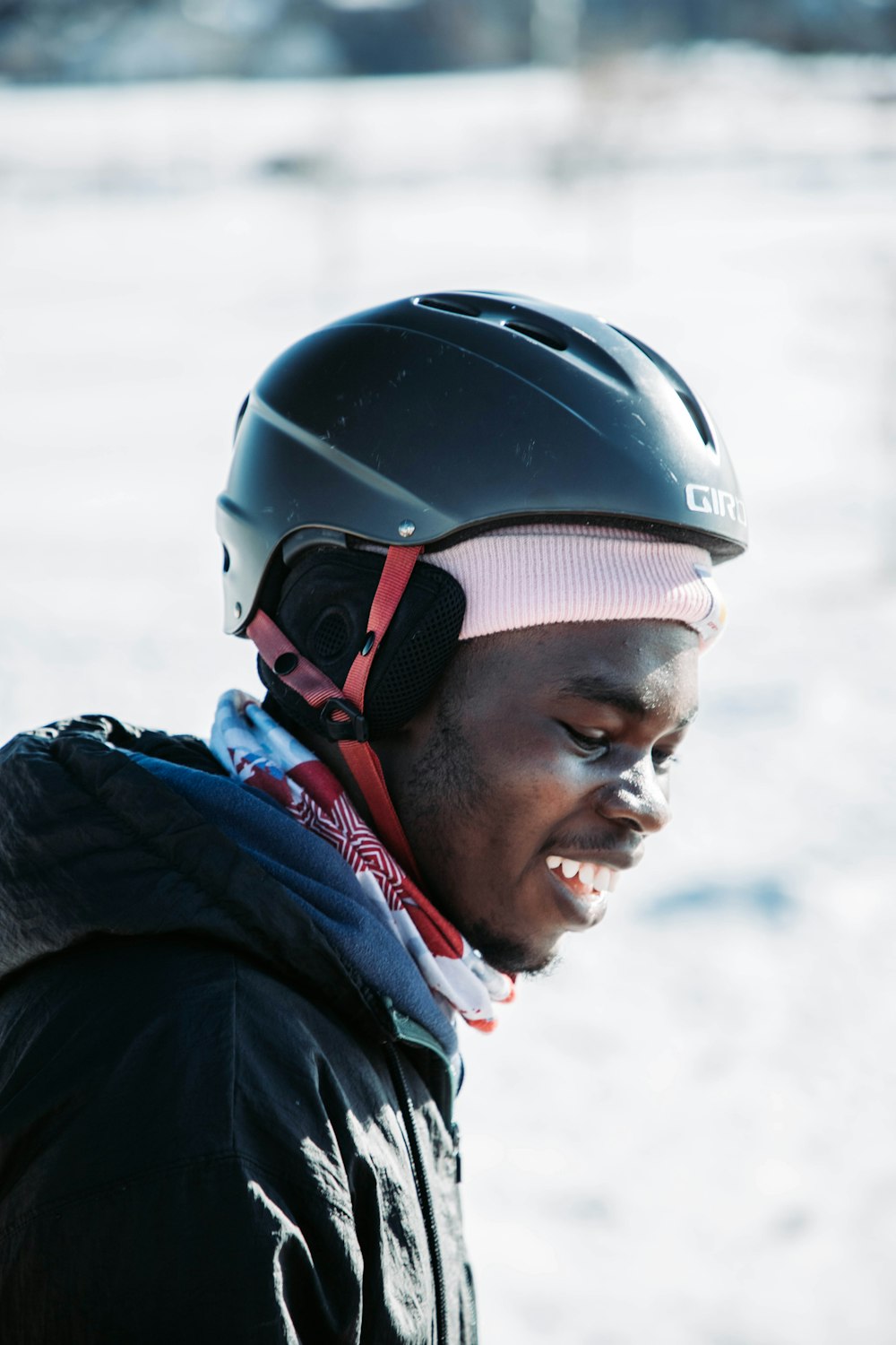 a man wearing a helmet and a scarf