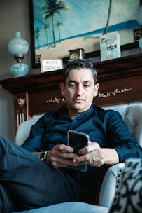 A happy member receiving a birthday notification on their smartphone.
