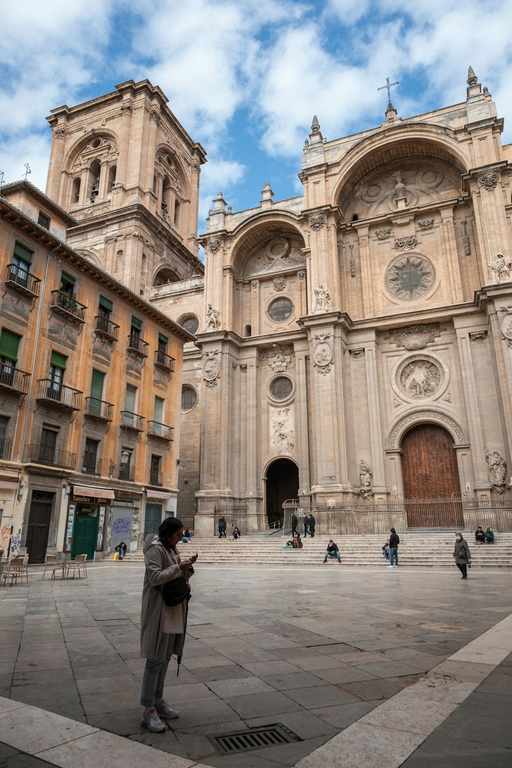 a person standing in front of a large building