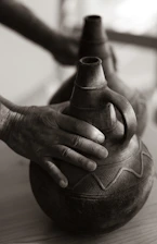 Close-up of handcrafted pottery showcasing detailed designs inspired by Ecuadorian heritage.