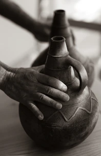 Close-up of handcrafted pottery showcasing detailed designs inspired by Ecuadorian heritage.