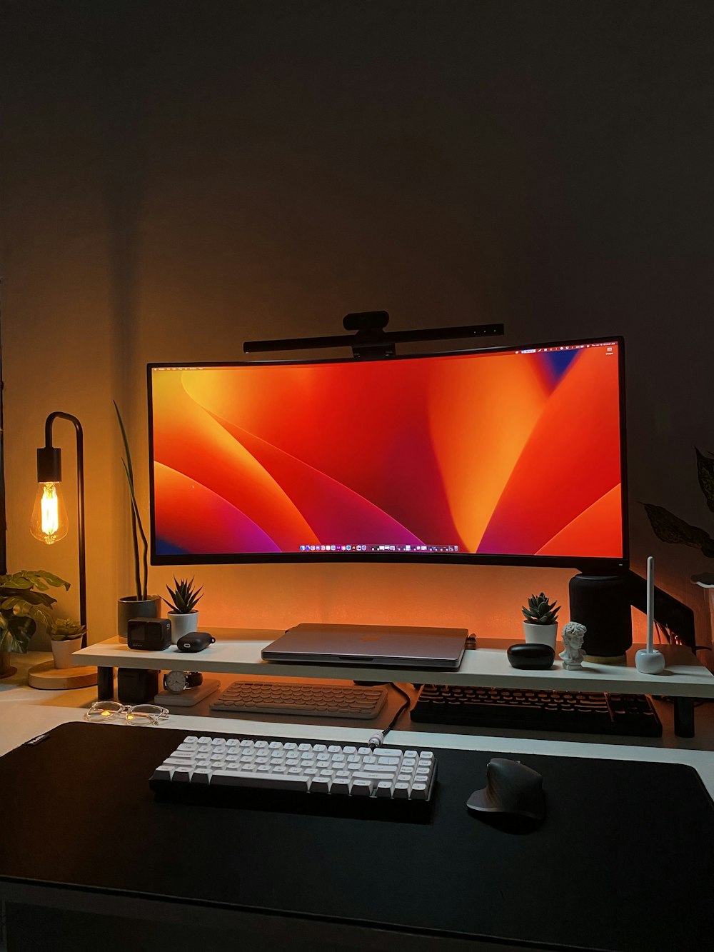 a desk with a computer monitor and keyboard