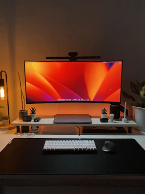 Sleek desktop setup featuring a colorful monitor and matching accessories.