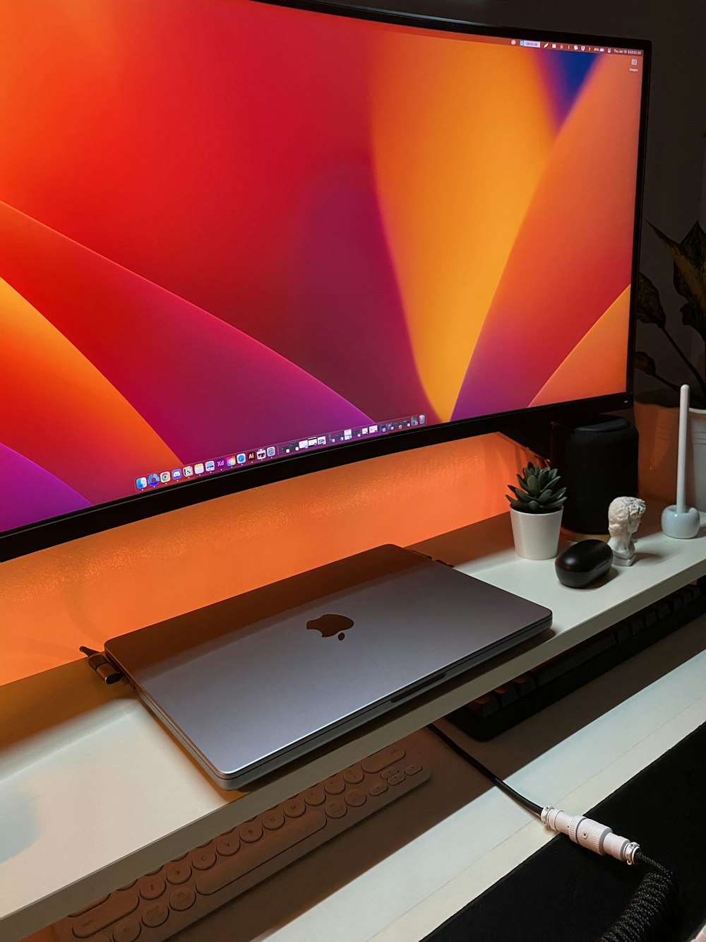 a computer monitor sitting on top of a desk