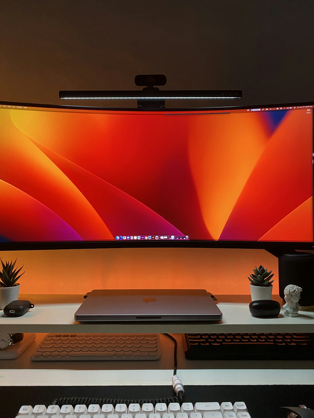 a desk with a monitor, keyboard and mouse