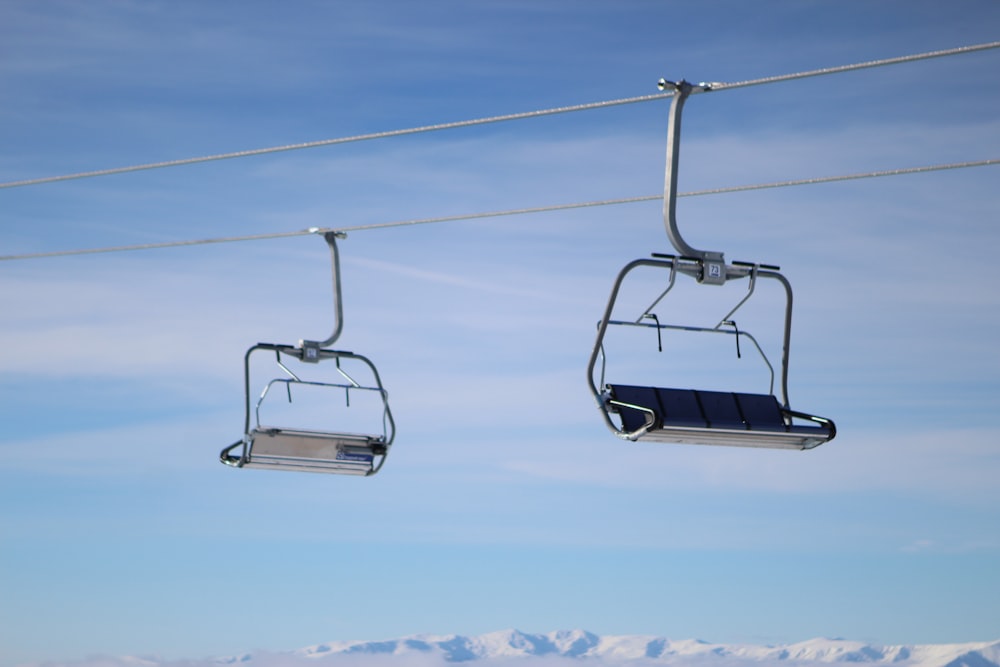 a couple of chairs hanging from a wire